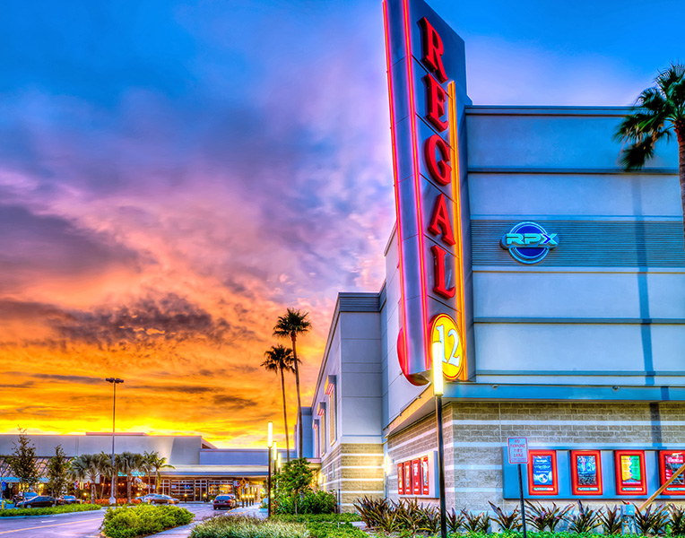 Broward Mall Regal Theatre at dusk against sunset.